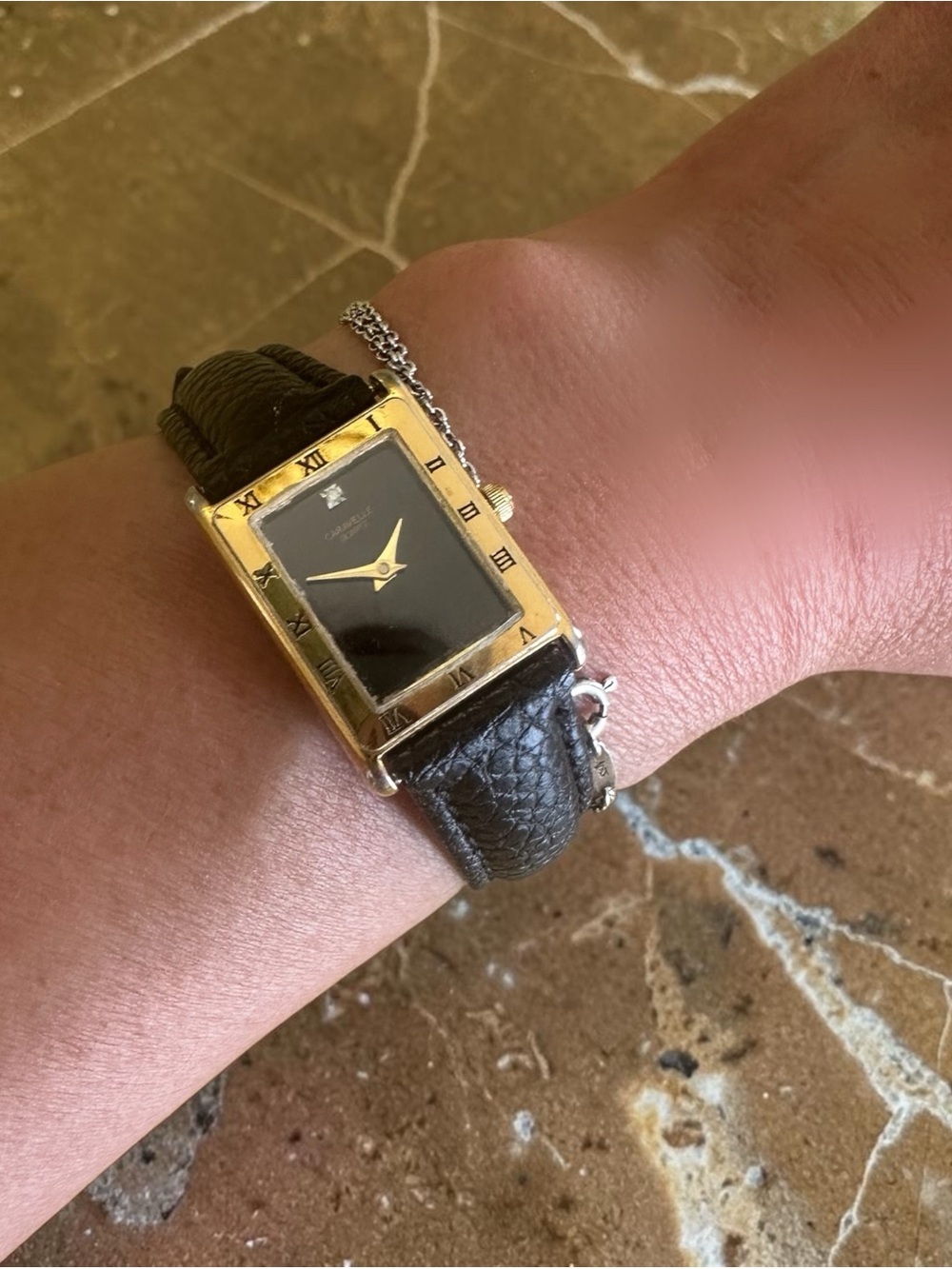 Caravelle by Bulova Black Dial Gold-Tone Watch with Black Leather Strap